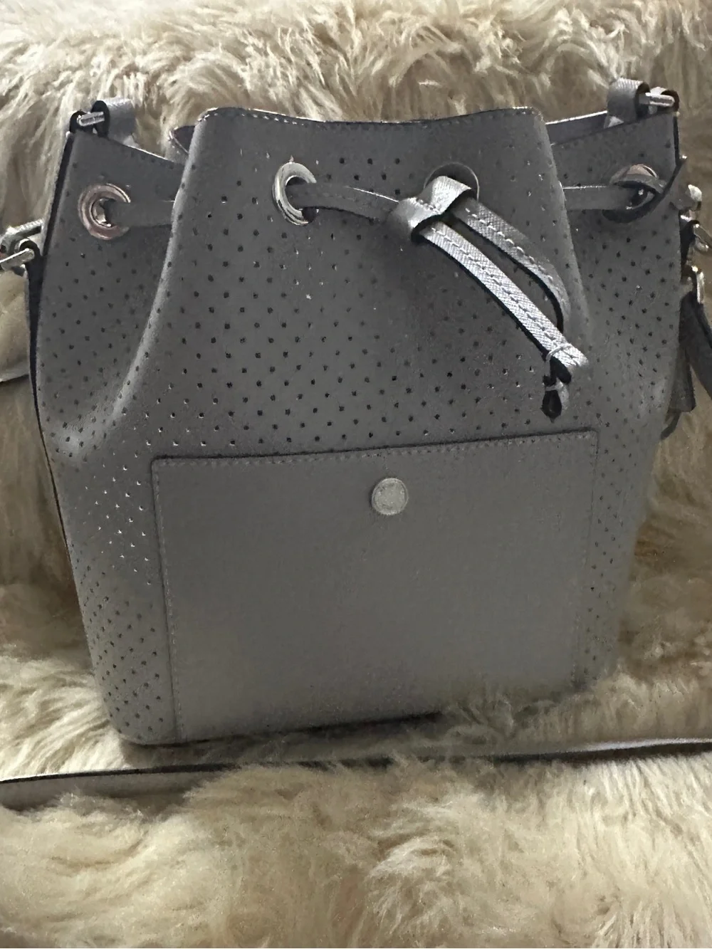 Michael Kors Perforated Drawstring Bucket Bag in Gray
